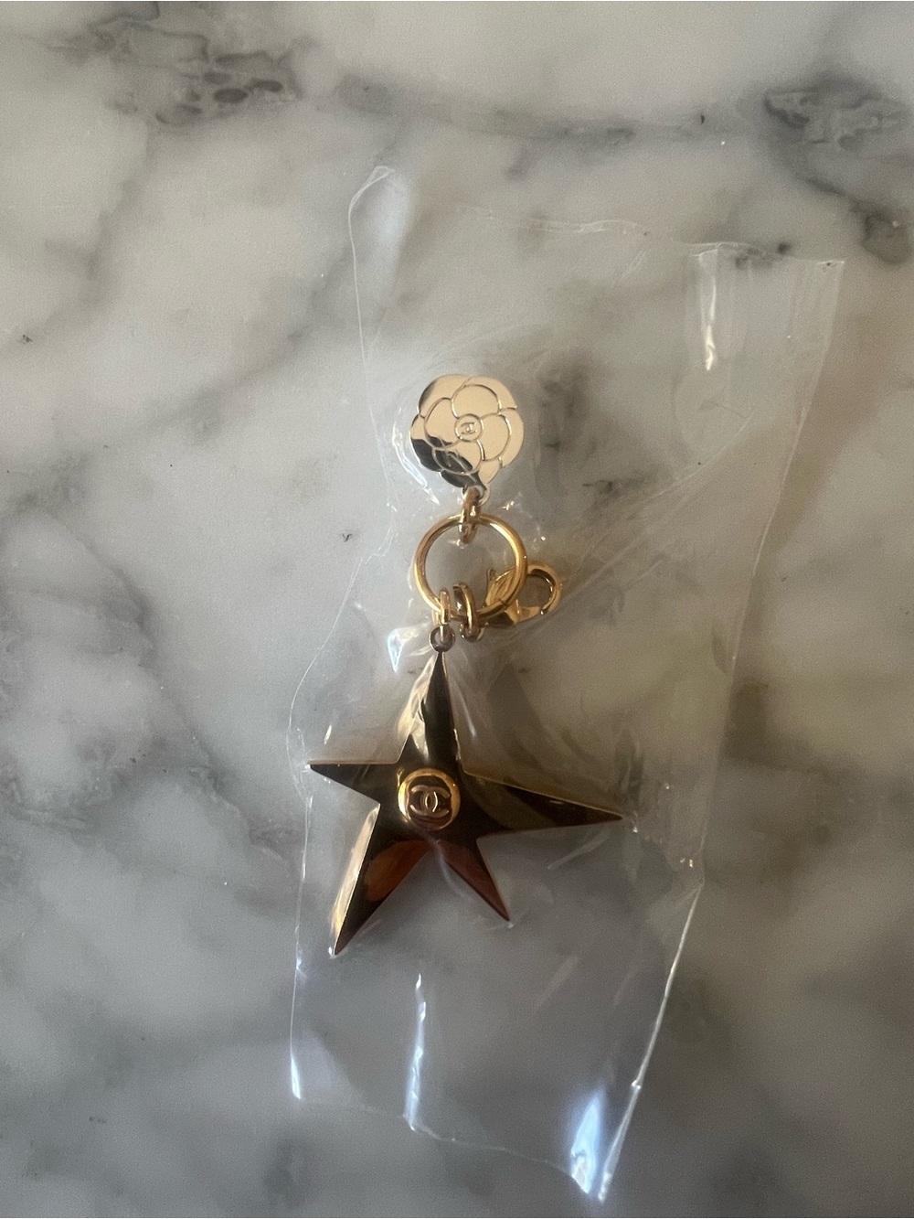 CHANEL Gold Star Charm with Floral charm